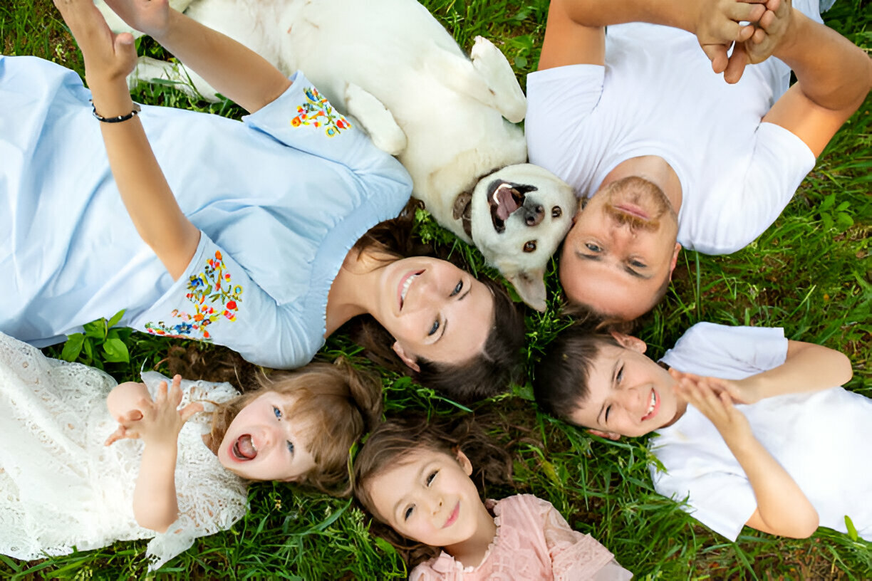 A family-mom, dad, and children having an out door bonds